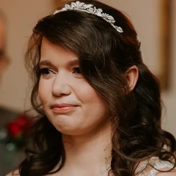 The tiara bride moved during the ceremony: a soft brown smoky eye, lashes and a peachy-nude lip
